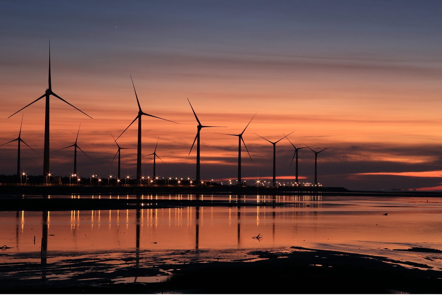 View of windmills at dusk